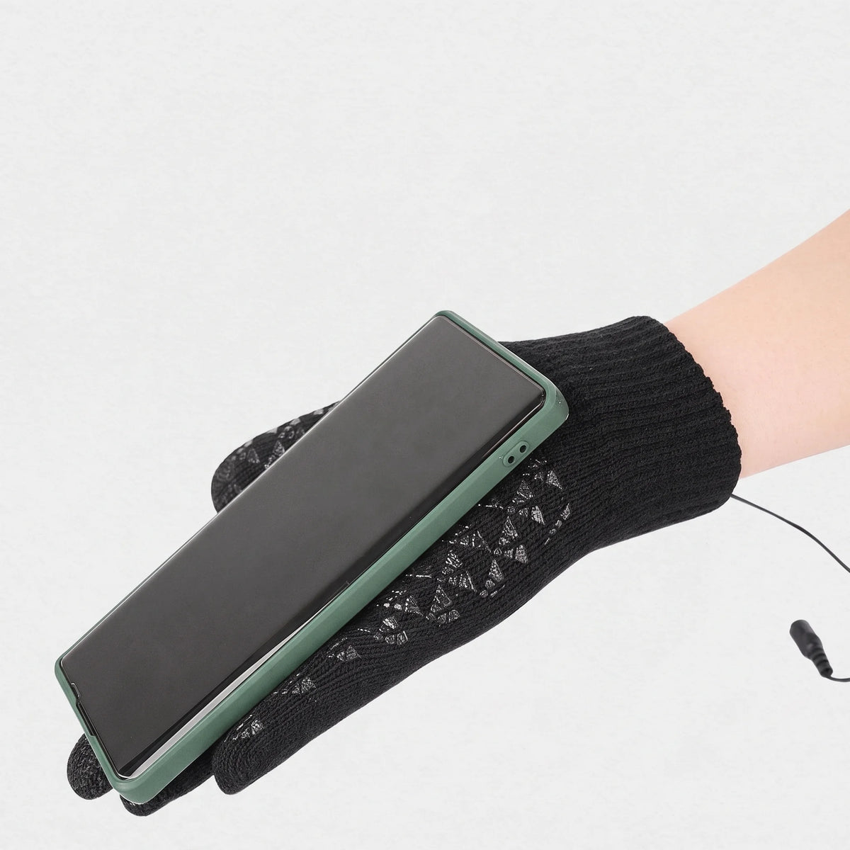 Paume du gant tricoté avec picots silicone antidérapants, téléphone en main