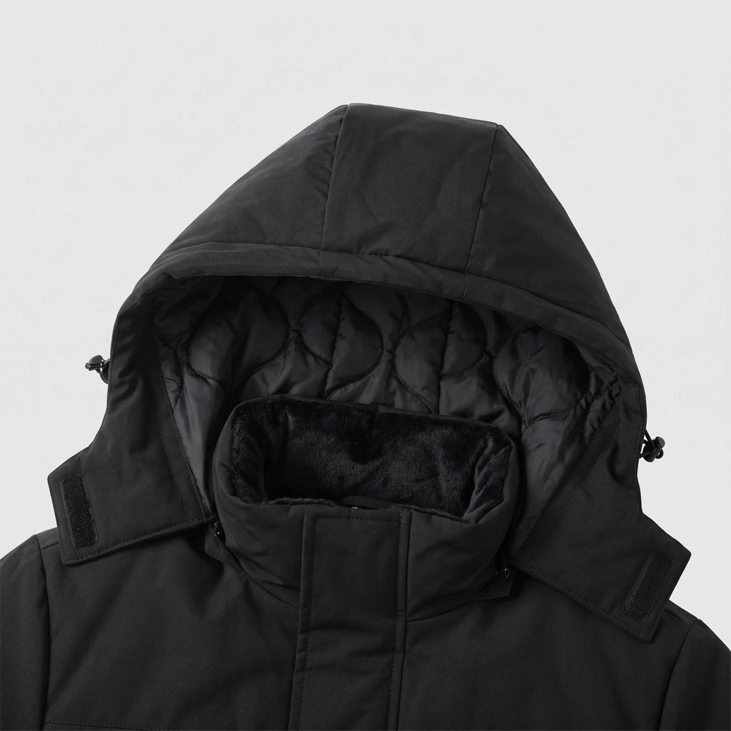 Capuche doublée matelassée et col montant doublé de peluche de la parka chauffante