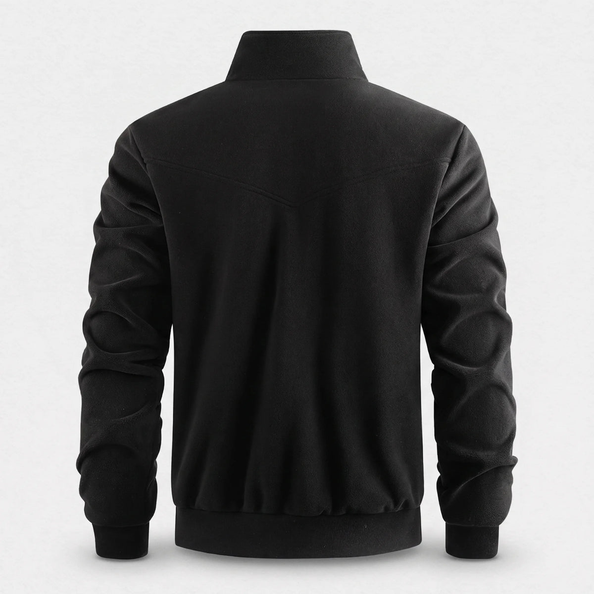Dos de la veste polaire chauffante noire, empiècement courbe et bas en bord-côte